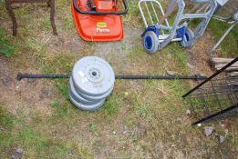 Six 5 kilo weights and a weight lifting bar.