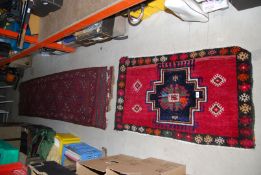 A long Eastern runner, damaged to one end, 25" x 103" and small rug 25" x 44".