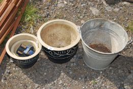 A galvanised bucket and two plant pots.