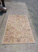 A Royal Jaipur Collection 100% wool carpet, cream ground, 72" long x 48" wide.