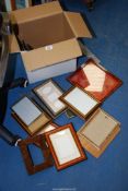 A quantity of picture frames and two sheepskin rugs.
