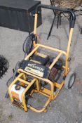 An Evolution petrol operated pressure washer with lance, running at time of lotting.