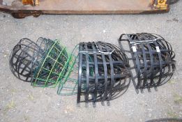 A quantity of wall mounted baskets.