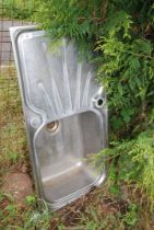 A stainless steel single drainer sink top.