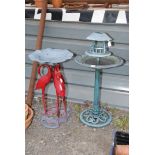 Two plastic bird baths.