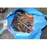 Plastic bag of tools, Stilsons, spanners etc.