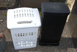 A waste bin and laundry basket.