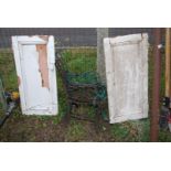 Two pairs of cast iron metal bench ends and two wooden cupboard doors.