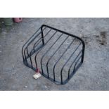 A wall mounting wrought iron Hay rack, 30'' x 17''.