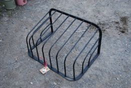 A wall mounting wrought iron Hay rack, 30'' x 17''.
