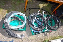 A quantity of mixed size hydraulic hoses, BSP, JIC and metric.