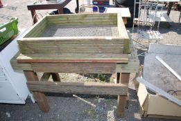 A timber sieve & stand with rocking rollers, the stand 41" x 24", the sieve 31 3/4" x 24" approx.