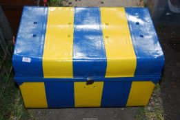 A painted metal trunk.