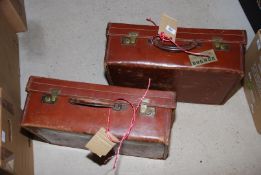 Two leather suitcases.
