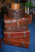 Four suitcases, a hat box and a collar box.