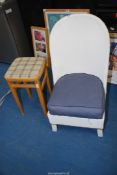 A Lloyd Loom style chair with coil spring seating and a stool.
