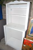 A white painted shelving unit, 30" x 16" x 65" high.