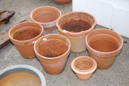 A quantity of Terracotta pots (one cracked).