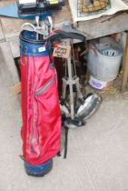 A golf bag,Life tech trolley and seven golf clubs.