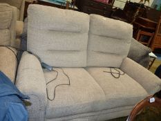 An electrically operated double reclining Antler beige upholstered contemporary two seater settee.