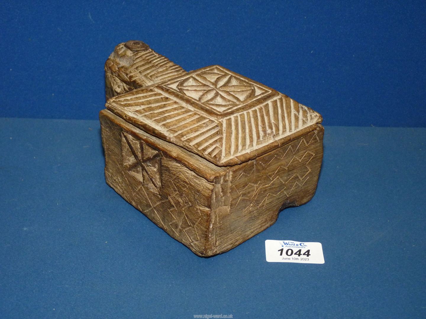 A Spice box with swivel lid and having carved geometric design, 7'' x 5'' x 3 1/2''.