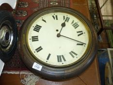 A circular Victorian wall clock, no glass, (working at the time of cataloguing).