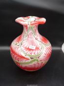 A very large Murano glass Vase in green, red and white feathered design, 16'' high x 11'' diameter.