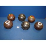 A set of brown Hemselite Lawn Bowls, size 4 7/2, plus two trophy bowls with presentation discs,