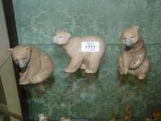 Three Lladro Brown bears.