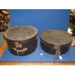 Two large black hat boxes, both lined, some wear.