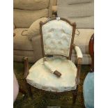 An elegant oak framed open armed Elbow Chair standing on turned and fluted legs, the seat,