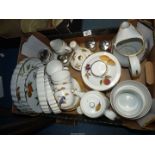 A quantity of Royal Worcester 'Evesham' china including; flan dishes, cups, saucers, biscuit barrel,