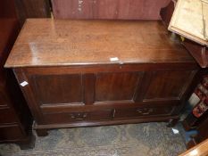 A three panel Oak Blanket Chest, with two lower short drawers, standing on bracket feet,