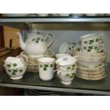 A good quantity of Colclough dinner, coffee and tea ware with green ivy design.
