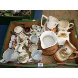 A quantity of jugs including; a jug having gold neck with a rams head to spout and pheasants,