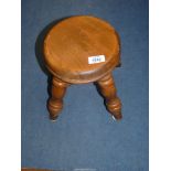 A light Oak/other woods circular stool standing on turned legs with a cross stretcher,