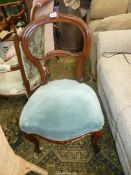 A Walnut/Mahogany framed late Victorian Side Chair standing on cabriole front legs,