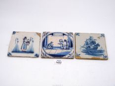 A pretty 18th century Dutch Delft tile painted in blue and manganese with a young girl holding a