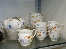 A Royal Albert tea service with flowers and butterflies decoration,