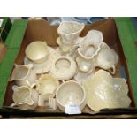 A quantity of Belleek china including teacup and saucer, vases, leaf dish, jug, cauldron, etc.