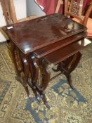 A Nest of three dark Mahogany Lyre ended Occasional Tables, the largest 22'' x 14'' x 23 3/8'' high.