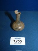 A small Roman glass bottle, 2nd-3rd century, chipped, 2 1/4'' tall.