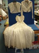A vintage hand made cream strapless wedding Dress with boned bodice,