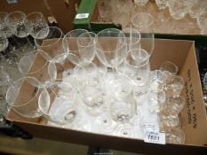 A quantity of glasses including; seven wine, six Champagne flutes and eight shot glasses.