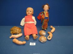 Two old dolls including one German made, both needing attention.