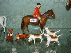 A quantity of Beswick ornaments to including a Huntsmen in red jacket on horseback,