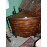 An unusual Walnut and crossbanded Oak carcase Corner Chest of four long drawers having brass