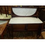 An Edwardian Mahogany Marble top Washstand and having an upstand with veined marble inset and with