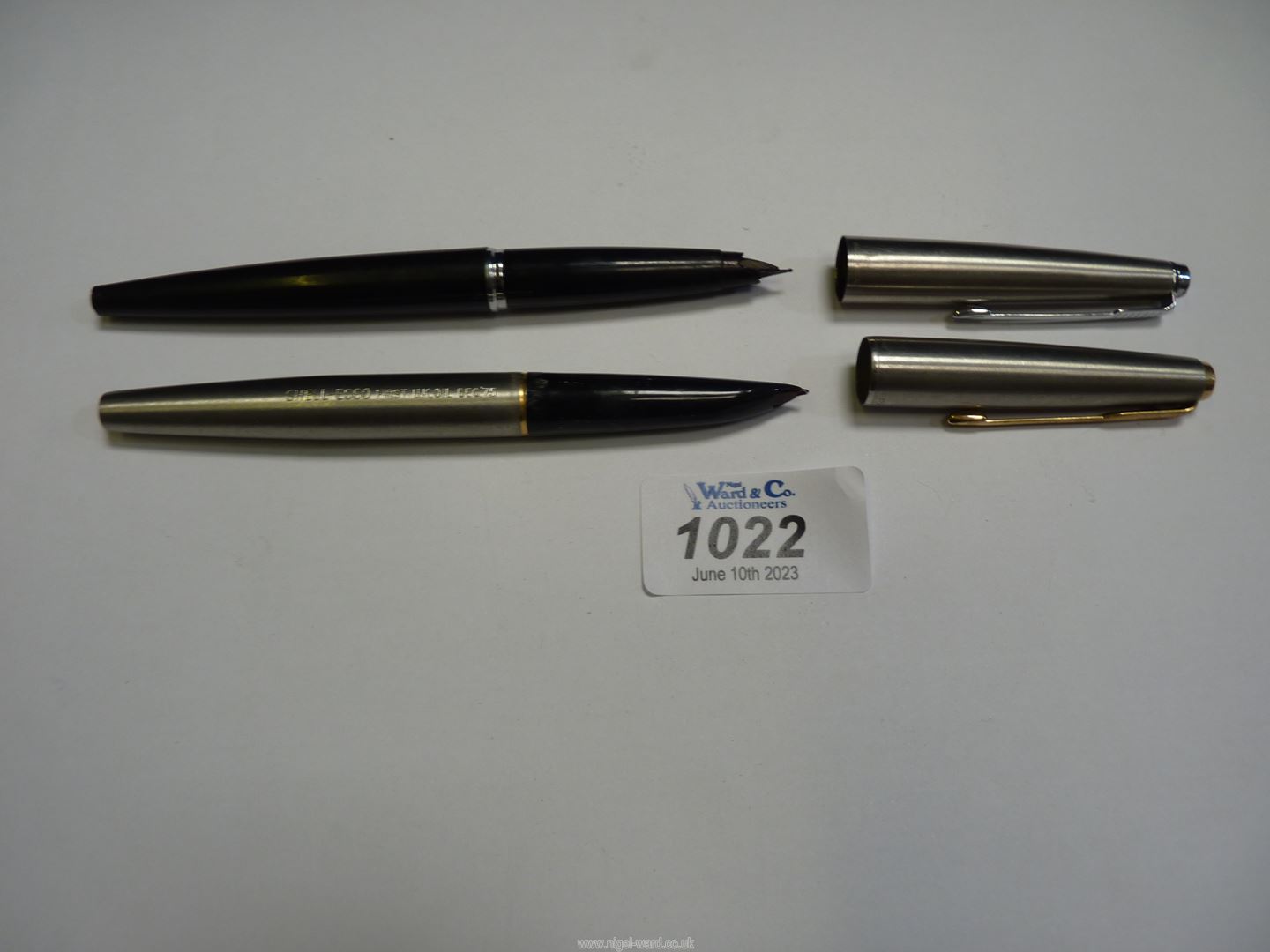 Two Parker fountain pens.