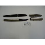Two Parker fountain pens.